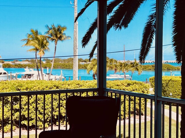 balcony featuring a water view