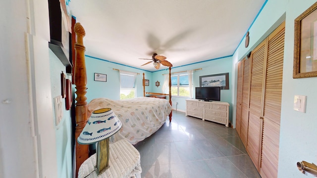 1W Cooks Is, Big Pine, FL 33043 - bedroom with dark tile patterned flooring, a closet, and a ceiling fan