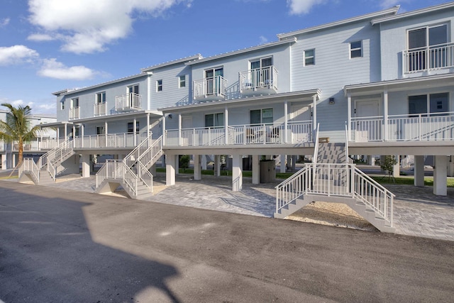 view of property with stairway and a residential view