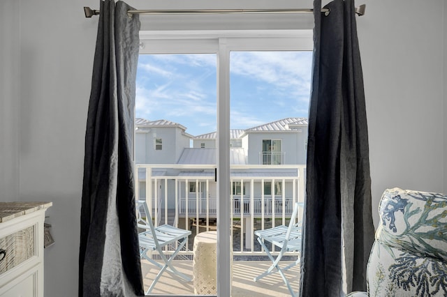 doorway to outside with a residential view