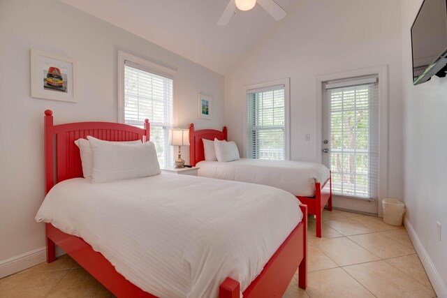 2600 Overseas Hwy Unit 5, Marathon, FL 33050 - bedroom with lofted ceiling, light tile patterned flooring, access to exterior, baseboards, and ceiling fan