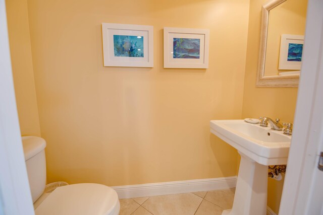 2600 Overseas Hwy Unit 5, Marathon, FL 33050 - bathroom with toilet, tile patterned floors, baseboards, and a sink