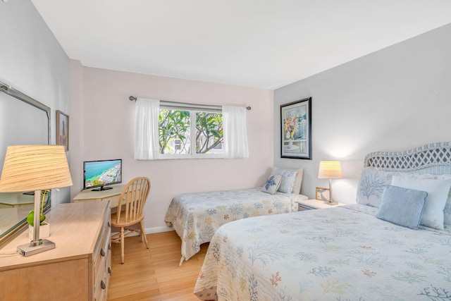 201 Ocean Dr Unit 110, Key Colony, FL 33051 - bedroom with light wood-style flooring and baseboards