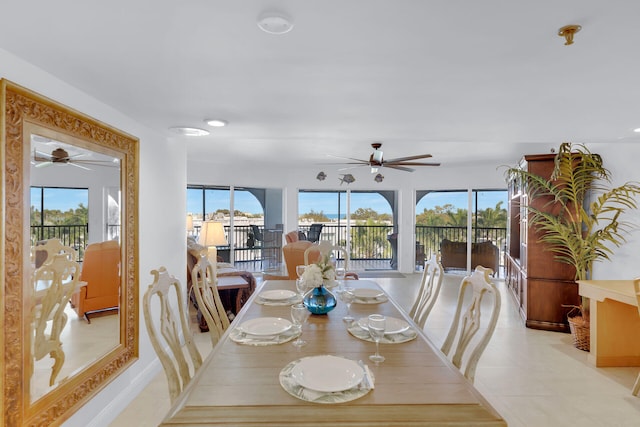 dining space featuring light tile patterned floors, plenty of natural light, and a ceiling fan