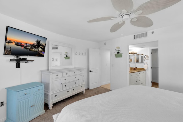 bedroom featuring ceiling fan, carpet, a sink, and visible vents