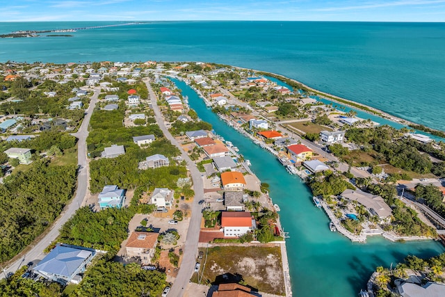 drone / aerial view featuring a residential view and a water view