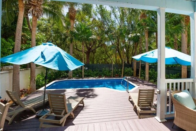 7202 Simran Ln, Duck, FL 33050 - view of pool featuring a wooden deck and a fenced backyard