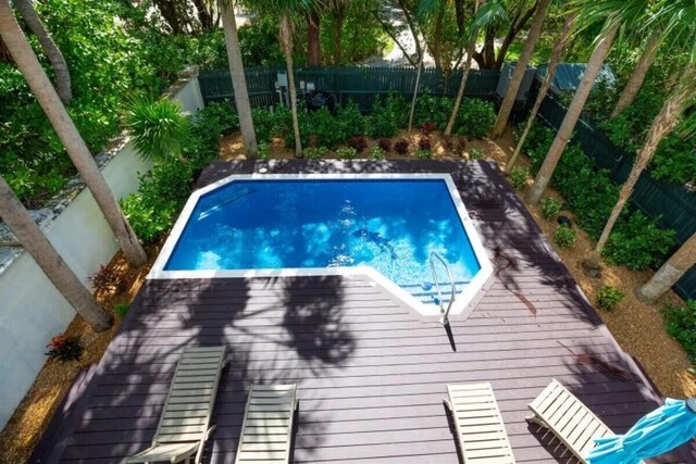 7202 Simran Ln, Duck, FL 33050 - view of pool featuring a wooden deck and a fenced backyard