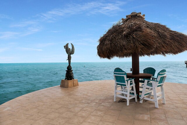 view of patio featuring a water view
