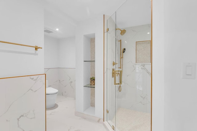 full bath featuring toilet, marble finish floor, and a marble finish shower