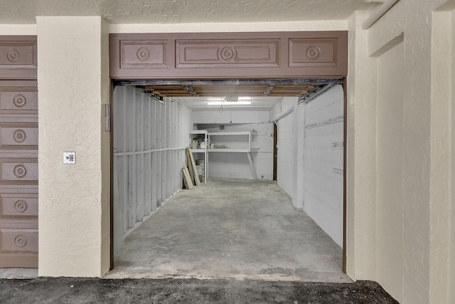 garage featuring a textured wall