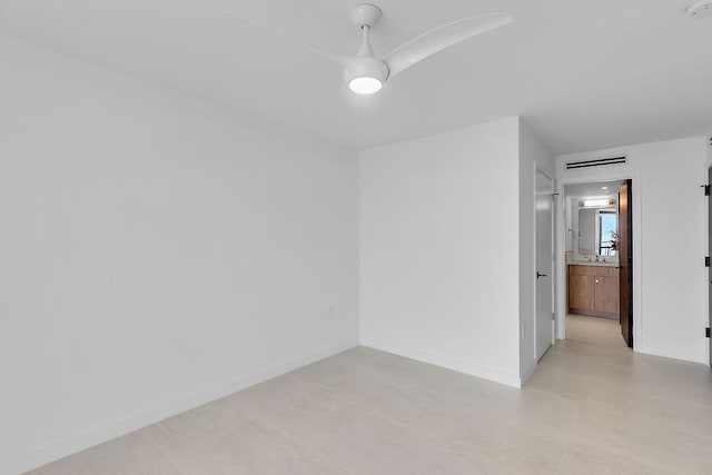 unfurnished room featuring visible vents and baseboards