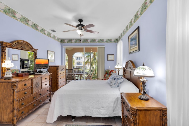 bedroom featuring light tile patterned floors, access to exterior, and visible vents