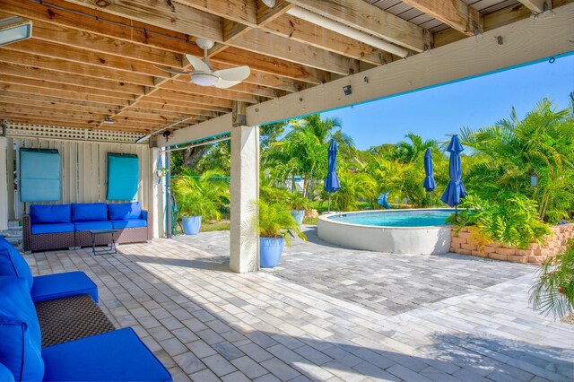 view of patio / terrace featuring outdoor lounge area and an outdoor pool