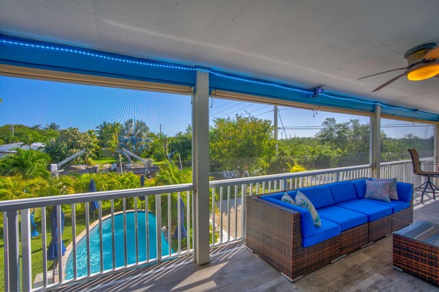 exterior space featuring a ceiling fan and an outdoor living space