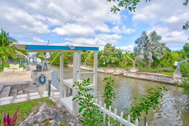 view of dock featuring a water view and boat lift