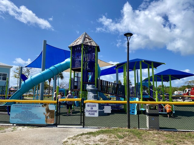 communal playground featuring fence