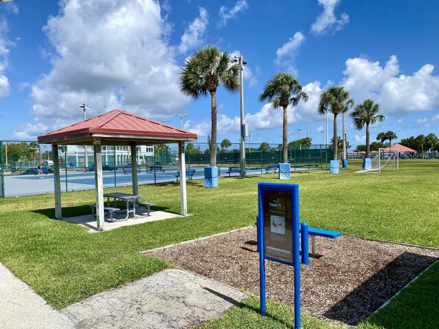 surrounding community with fence and a gazebo