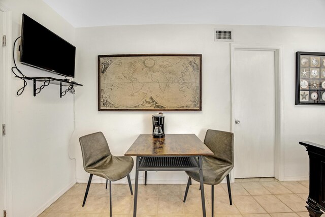 dining room with visible vents, baseboards, and light tile patterned floors