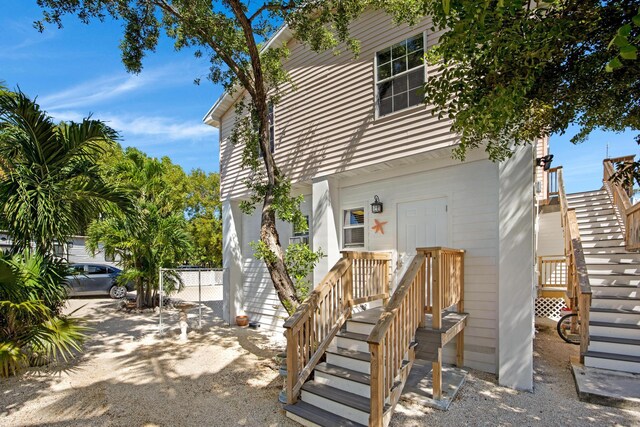 exterior space featuring fence and stairway