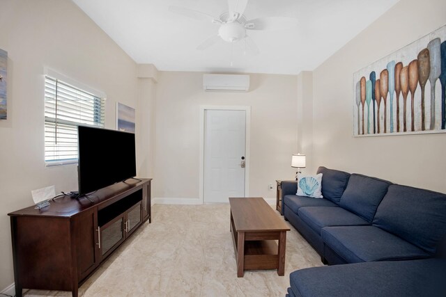 living room with a wall unit AC, baseboards, and a ceiling fan