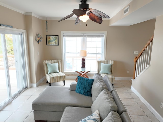 1590 Dolphin Dr, Marathon, FL 33050 - living area featuring light tile patterned flooring, a ceiling fan, ornamental molding, and stairway