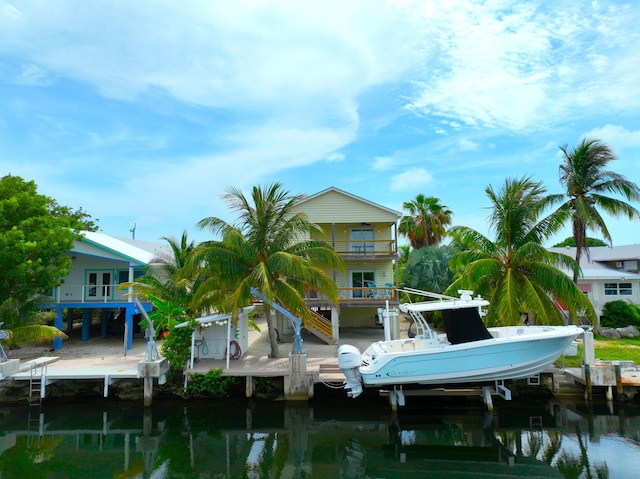 1590 Dolphin Dr, Marathon, FL 33050 - dock area with boat lift, a water view, and a balcony
