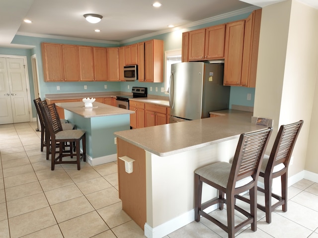 1590 Dolphin Dr, Marathon, FL 33050 - kitchen with stainless steel appliances, a kitchen breakfast bar, light countertops, crown molding, and a peninsula