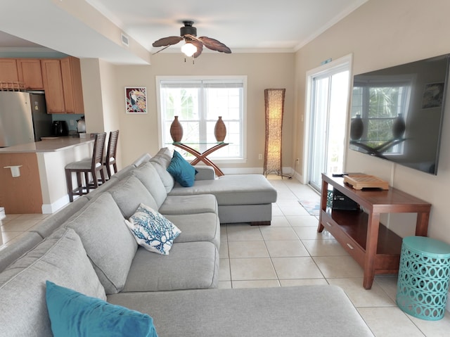 1590 Dolphin Dr, Marathon, FL 33050 - living area featuring a ceiling fan, light tile patterned floors, and crown molding