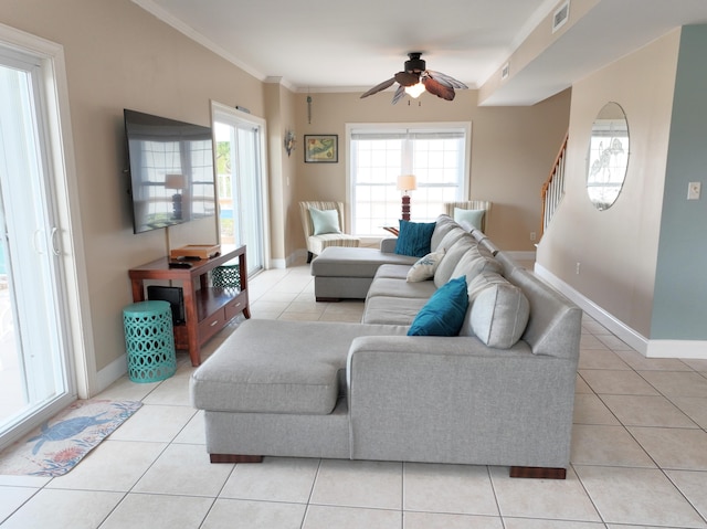 1590 Dolphin Dr, Marathon, FL 33050 - living room with light tile patterned floors, a ceiling fan, crown molding, and stairs
