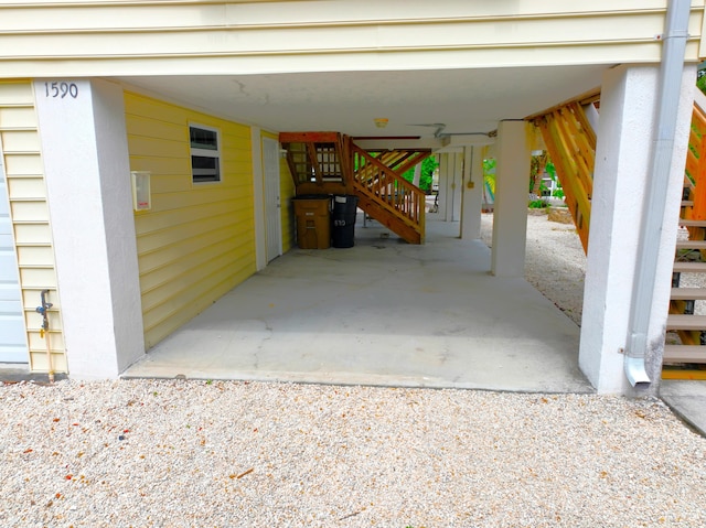 1590 Dolphin Dr, Marathon, FL 33050 - garage featuring a carport and gravel driveway