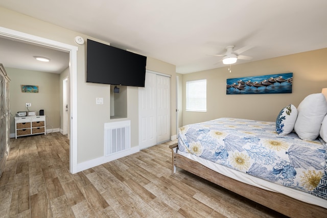11282 2nd Ave, Ocean, Marathon, FL 33050 - bedroom featuring a closet, light wood-style flooring, visible vents, baseboards, and a ceiling fan
