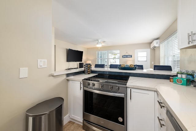 11282 2nd Ave, Ocean, Marathon, FL 33050 - kitchen featuring white cabinets, a peninsula, electric stove, light stone counters, and a wall unit AC