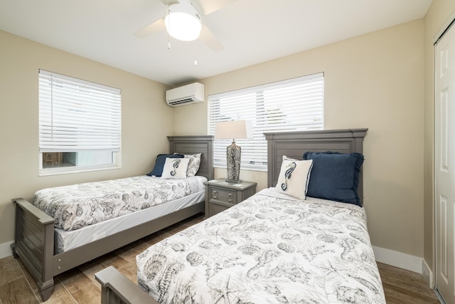 11282 2nd Ave, Ocean, Marathon, FL 33050 - bedroom with baseboards, wood finished floors, an AC wall unit, and a ceiling fan