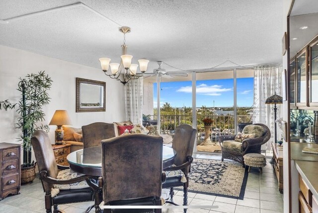 2000 Coco Plum Dr Unit 603, Marathon, FL 33050 - dining space with a chandelier, floor to ceiling windows, plenty of natural light, light tile patterned floors, and a textured ceiling
