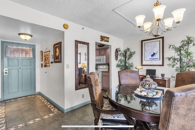 2000 Coco Plum Dr Unit 603, Marathon, FL 33050 - tiled dining area featuring a chandelier and a textured ceiling