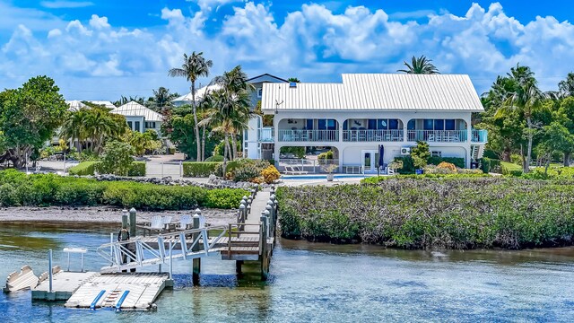 359 Stirrup Key Blvd, Marathon, FL 33050 - dock with a balcony, a water view, and an outdoor pool