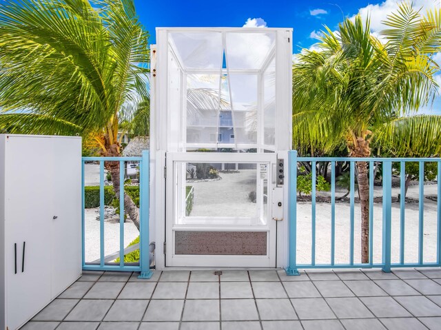 exterior space featuring light tile patterned floors