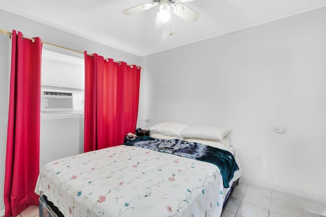 bedroom featuring tile patterned flooring, cooling unit, and a ceiling fan