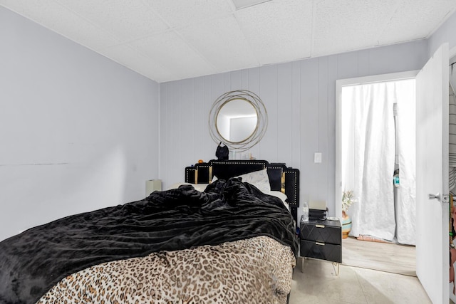 bedroom featuring multiple windows and wood finished floors