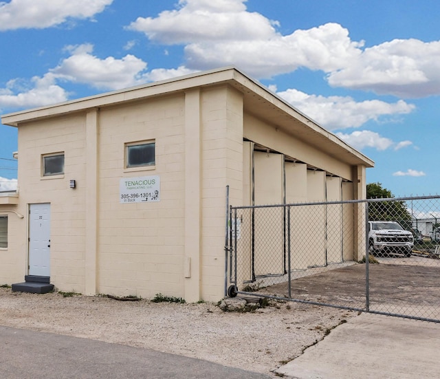 view of outbuilding with fence