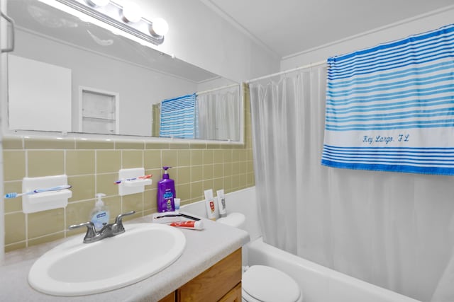 full bath with vanity, decorative backsplash, tile walls, toilet, and shower / tub combo with curtain