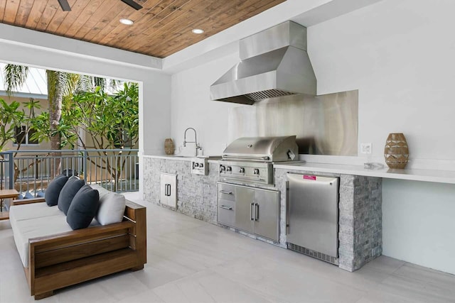 view of patio with an outdoor living space, a grill, and exterior kitchen