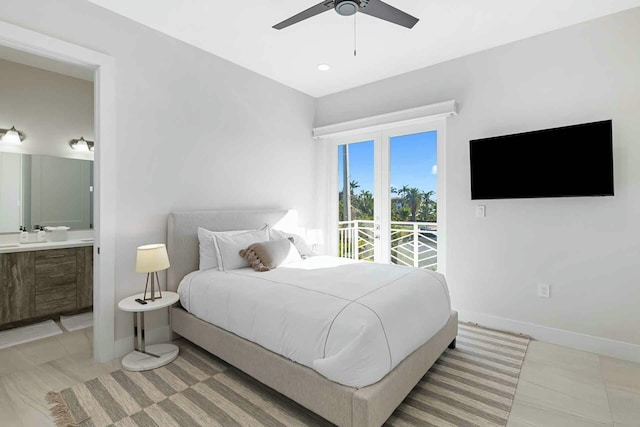 bedroom featuring access to outside, baseboards, ensuite bathroom, and ceiling fan