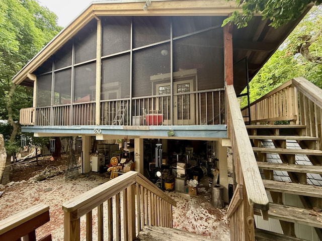 20 Park Rd, Islamorada, FL 33036 - rear view of property featuring a sunroom and stairs