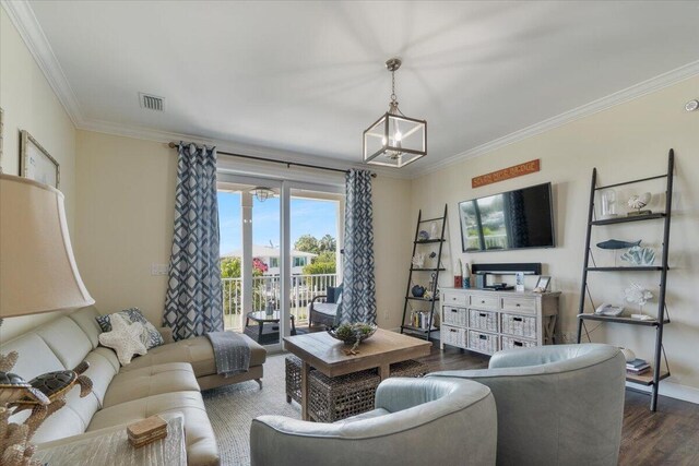 219 Sombrero Beach Rd Unit 2, Marathon, FL 33050 - living area with visible vents, crown molding, dark wood-type flooring, and a chandelier