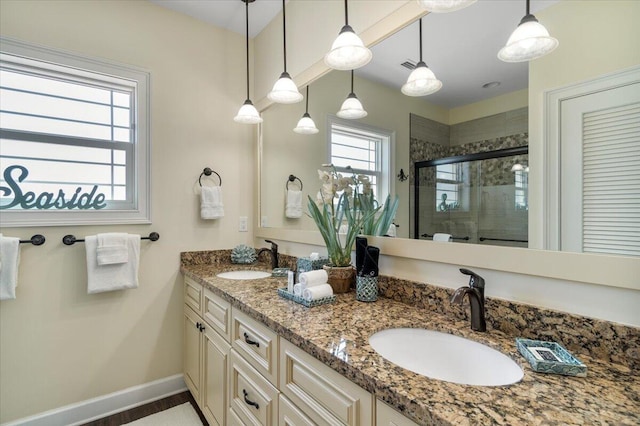 219 Sombrero Beach Rd Unit 2, Marathon, FL 33050 - full bath with a stall shower, double vanity, baseboards, and a sink
