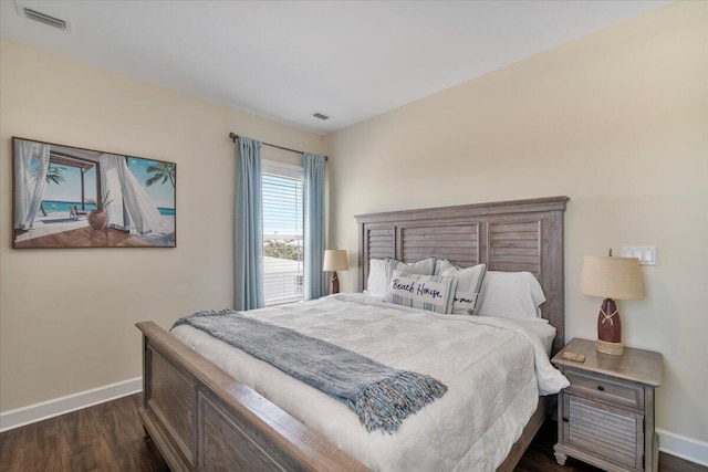 219 Sombrero Beach Rd Unit 2, Marathon, FL 33050 - bedroom with dark wood finished floors, baseboards, and visible vents