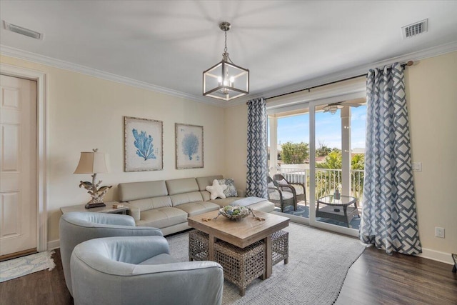 219 Sombrero Beach Rd Unit 2, Marathon, FL 33050 - living area with a notable chandelier, visible vents, crown molding, and wood finished floors