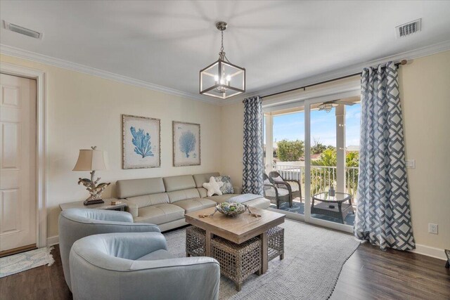 219 Sombrero Beach Rd Unit 2, Marathon, FL 33050 - living room featuring visible vents, an inviting chandelier, crown molding, and wood finished floors